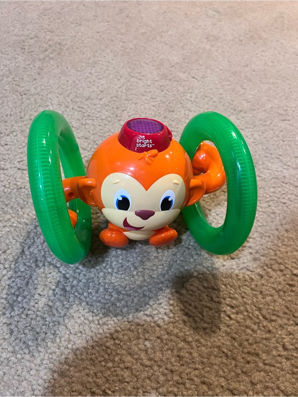 Bright starts crawling Orange Monkey music Toy with Green Rings baby